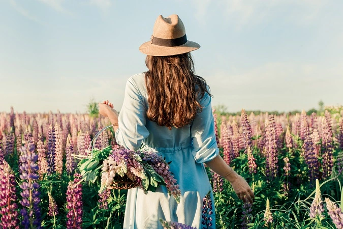 A,Girl,In,A,Blue,Dress,On,A,Purple,Field